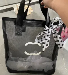 Bolsa de ombro de malha preta e branca de designer para bolsa de compras de moda feminina, logotipo de carta clássico, decoração de fita de lavagem transparente, ambiente portátil de praia