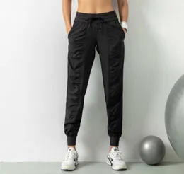 Yoga Pants Drawstring Elastic midjejoggare Löst fit andningsbara gymkläder Kvinnor Sportbyxor som kör fitnessficka Casual Over4214889