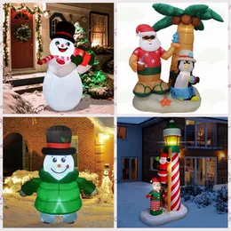 Оптовый воздух надувает игрушечные рождественские надувные надувные надувные надувные снеговики, держащая подарочную коробку, поднимаясь на Санта -Клаус с пальмовым деревом для украшения фестиваля