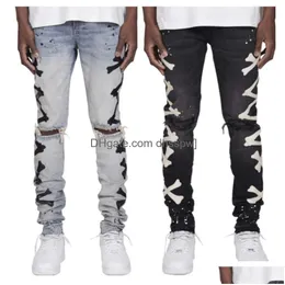 Mäns jeans högkvalitativ 2024 MENS TRED HOLE PRINTED ELASTIC With Bone Printing Trend Style Drop Delivery Apparel Clothing DHCU2