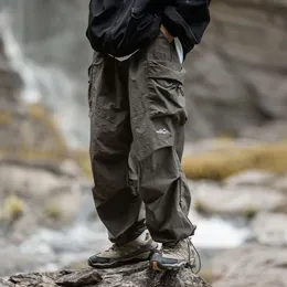 Calças de soldado de pára-quedas de bolso grande duplo plissado primavera novas roupas de trabalho casuais soltas ao ar livre à prova d'água