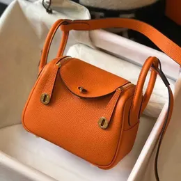 Turuncu omuz çantası tasarımcıları hamur tatlısı premium cowhide doktor çantası lychee desen çantası - çok yönlü taşıma seçenekleri taşır kutusu tarzı yastık kadın çantası taşıma