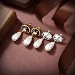 Projektantka CHARME STUDNIKA VIVIANE LUXU KOBIETY Luksusowa biżuteria Saturn Earing Pearl Gold Cenring Cjeeweler Planet Westwood Woman 673