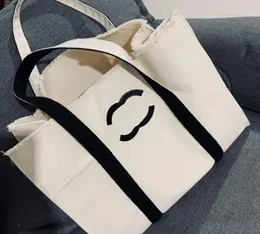 デザイナーイブニングバッグハンドバッグサマービーチハンドバッグレターショルダーバッグオフィスバッグ高品質のクラシックレディースキャンバスバッグレトロな女性用豪華なバッグバッグ