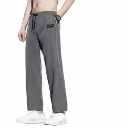 Homens Sweatpants Ice Silk Suave Cordão Elástico Na Cintura Reta Pernas Largas Bolsos Macio Respirável Homens Verão Calças Esportivas Joggi Z7Hf #