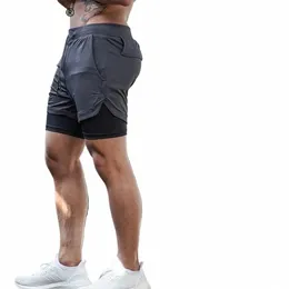 メンズジムスポーツショーツジョギングランニングブレーニング可能なフィットンエクササイズダブルレイヤーシャツ隠しポケットカジュアルカモエショーツK7ZO＃