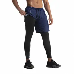 2023 Men's Sports Pants Fitn Suit Fake Two Piece Running Pants Snabbtorkning Elastiska tights Gymkläderbyxor för man I5JC#