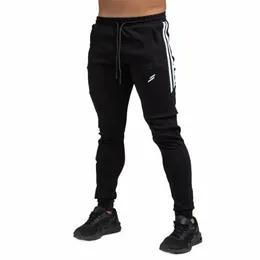 2023 Весенние новые бегуны мужские спортивные штаны уличная одежда удобный спортивный костюм для бега мужские брюки многофункциональные брюки F66y #