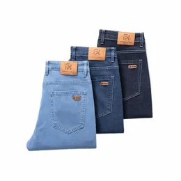 Estilo clássico outono masculino solto reto busin jeans cor sólida tecido liso denim calças estiramento masculino roupas de marca azul h2mq #