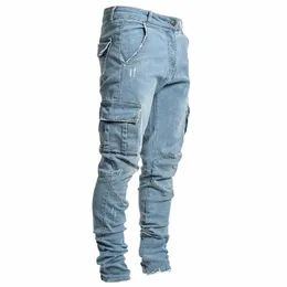 Jeans da uomo europei e americani Fi Multi-tasca Leggings elastici spessi Pantaloni sportivi casual giornalieri Jeans cargo di alta qualità V3Du #