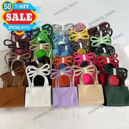 Sacola de compras de tamanho médio e pequeno Bolsa de compras de 2 vias Bolsa de ombro crossbody de couro vegano Mulheres homens preto OXblood LOGO em relevo famosa bolsa cosmética