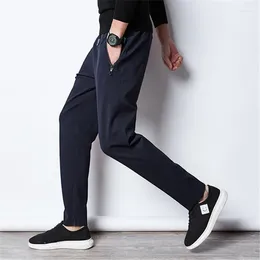 Męskie spodnie swobodni mężczyźni z nadwagą odzież Czarna moda dreski streetwearne sporne sporne spodnie męskie ubrania męskie tkaniny