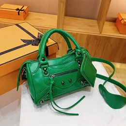 Wholesale ladies handbag this year's popular rivet crossbody bag Joker solid color leather retro motorcycle bag street trend tassel women handbag 6 colors 18055#