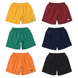 Verão novo estilo bordado borboleta calças de praia de secagem rápida soltas calções esportivos casuais calças masculinas e femininas