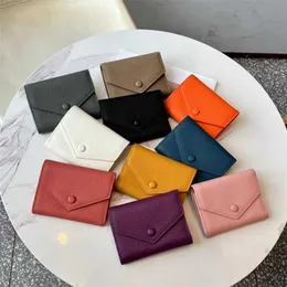 Portamonete Guangzhou Donna 2024 Nuova vera pelle 30% Fermasoldi Strato Portamonete in pelle bovina Portafoglio Versatile Borsa di carta piccola alla moda stile corto