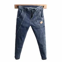 Wysokiej jakości niebieskie dżinsowe dżinsy mężczyźni szczupły 2023 Nowy projekt młodzież Joker przystojny koreańscy studenci streetwearu Pencil Pants Men C0fb#
