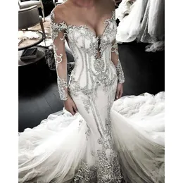 UPS Sheer Mesh Top Mermaid Dresses Tulle spets Applique pärlstav kristaller långa ärmar bröllop brudklänningar