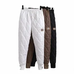 Plus Size Winter Down Cott Pants Kvinnor Tjock varma harembyxor Kvinnlig elastisk hög midja Casual Loose Trousers Pantals 4XL D2KW#