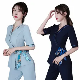 الزي الرسمي للنساء Workwear Beauty Clothing Beaficibic Scrubs Work Compley Beauty Sal Tattoo Artist Uniform 2PCS Set Wholesale R7PE#