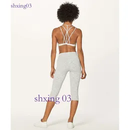 Invigorate Bra High Support yoga exercise bra back button is easy to put on and take off