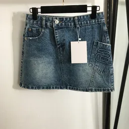 Gonne Jean per ragazze Abito di design tascabile irregolare Abiti di jeans di lusso femminili Gonna di design di personalità estiva Abito di marca