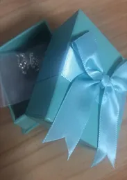 Modedesignerörhängen för kvinnliga smycken med kristalldiamantbokstil örhängen för festbröllop med Blue Bow -presentförpackning7376460