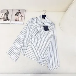 Designer designs the latest runway show with the same letter striped pile neck long sleeved shirt