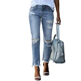 Мода Сломанные отверстия кисточка прямой джинсы женская средняя кнопка пуговица сплайсинга джинсовых штанов.