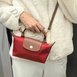 Läder clearance grossist och väska hjärtväska lyx 2024 tote crossbody frakt källa vår sommar boce handväska kohud femme mini kvinnor klimp