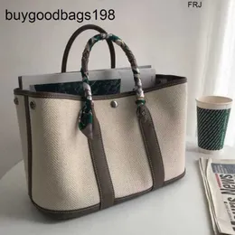 Designer Garden Bags Tote Brand 2024 Nuovo tela con borse da donna in pelle vera e propria a strato di cravatta a strato.