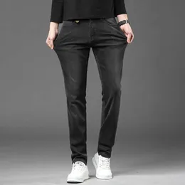 High 2023 End Grey Versatile Jeans för herrens höst Elastic tät montering och stilig gata modemärke smala fit byxor
