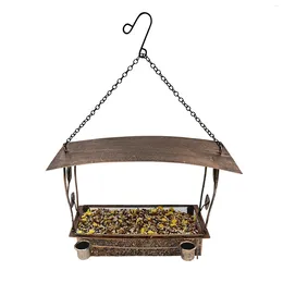 Другая птица поставляет металлическую фидеру - антикварная бронзовая висящая кормление декоративное открытие для садового внутреннего дворика