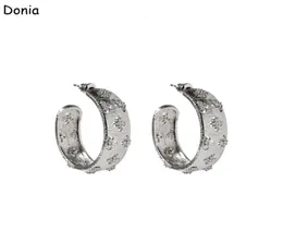 Donia المجوهرات الفاخرة الأزياء الأوروبية والأمريكية Fourleaf Flower Cshaped Titanium Steel Threecolor Creative Designer EAR1072901