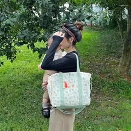 収納バッグベイビーママのための韓国チェリーマタニティバッグおむつおむつママのハンドバッグ