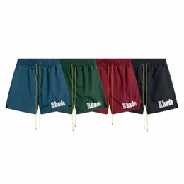 Rhude American High Street Briefe gestickt gelegentlich Sportshorts für Männer und Frauen Lose Viertel Kordelkordel Schnelltrocknungshose Modelabel