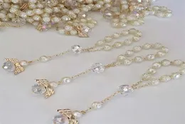 10 pezzi di battesimo del battesimo del colore avorio 10pcs con angeli rosari in oro perle acriliche perle acriliche di dito di comunione Rosari 2201241461307