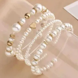 Pulseiras de casamento 4pcs/conjunto de pulseiras de pérolas de imitação branca para mulheres novas jóias de festa de casamento elegante e elástico de miçangas