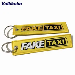 Keychains Lanyards 1 bit 3 stycken till salu falska taxibilar med broderade gula etiketter på båda sidor nyckelringar för motorcyklar ryggsäckar nyckelringar gåvor grossist j