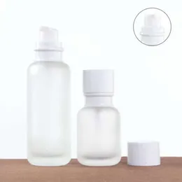 حليب التجميل بالجملة الزجاجية زجاجة زجاجة غلاف أبيض تغليف المواد