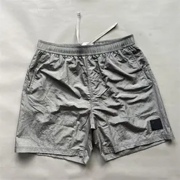 Europa Designer Classic Fashion Men Shorts luźne dopasowanie Szybkie suszące metalowe nylonowe szorty na zewnątrz sporty sporty swobodne 5 punktów na plażę pływanie unisex spodnie Si