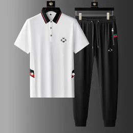 Designer Men Sports Suit Mäns och kvinnors utomhus fritidssportkläder Löst och fashionabla par Sportwear Street Man Summer Short Sleeved Pants Pure Cotton Set