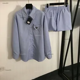 Calça de marca definido feminino Blusa designer de duas peças Camisa de manga longa Moda de moda Logo Pontas curtas Terre