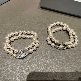 Charm Westwoods podwójna perła Pearl Full Diamond Saturn Bransoletka ma średniowieczny styl z osadzonymi diamentami i złotymi bransoletami