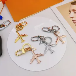 Tasarımcı Moda Uçak Anahtarlıkları Kadınlar Erkekler Metal Uçak Anahtar Zincirler Alaşım Alaşım Uçak Çekiş Biblolar Cazibe Anahtar Süsleme Mektupları Anahtarlar Halkalar