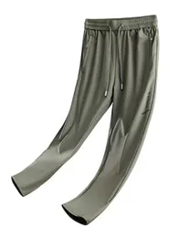 Panelli dritti estivi uomini traspiranti ghiaccio fresco nylon allungamento pantaloni da binario casual maschio più taglia 8xl 240423