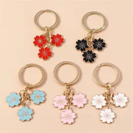 Schlüsselanhänger süße Kirschblüte Anhänger Keychain Floral Mobiltelefonkette für Handtaschendekoration Einfache Legierung Charme Keyrings Accessoires