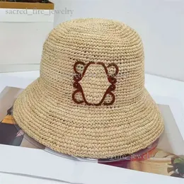 Loewe halm sommar hink loeweee hattar designer raffia bonnets kvinnor herr strandhatt gräs vävt cap anagram halmhat platt loewe cap mode klassisk retro trend 526