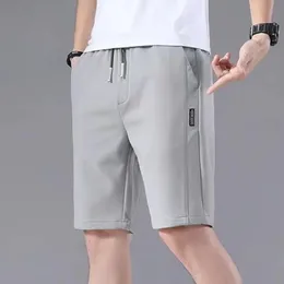 Masculino shorts shorts de cor sólida Padrão reto do tipo solto Tipo de verão Elástico Coloque calças de corrida casuais de cordão para masculino 240513