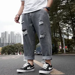 Мужские джинсы разорвали повседневные свободные укороченные брюки модный жирный папа