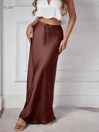 Юбки Jyate Satin High Isling Shinking Tie Solid Женская юбка Элегантная мода, давно подходящая для женщин, причинная женщина одежда